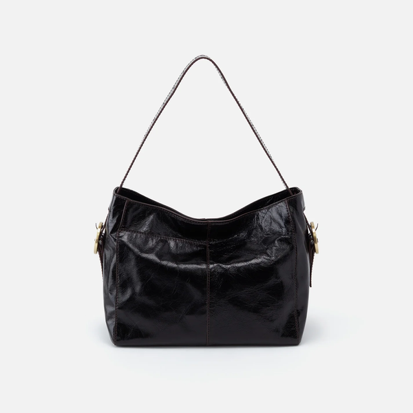 HOBO Render Shoulder Bag in Black Polished Leather Facing Forward with Antique Brushed Brass Hardware Buckles on the side and a single leather strap.