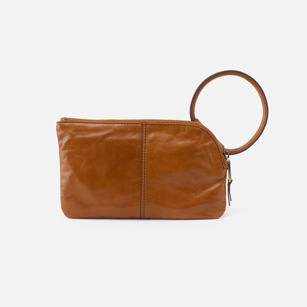 Backside View HOBO Sable Wristlet Crafted in Truffle Polished Leather. An Iconic Wristlet-Clutch Hybrid with a Circular Handle.